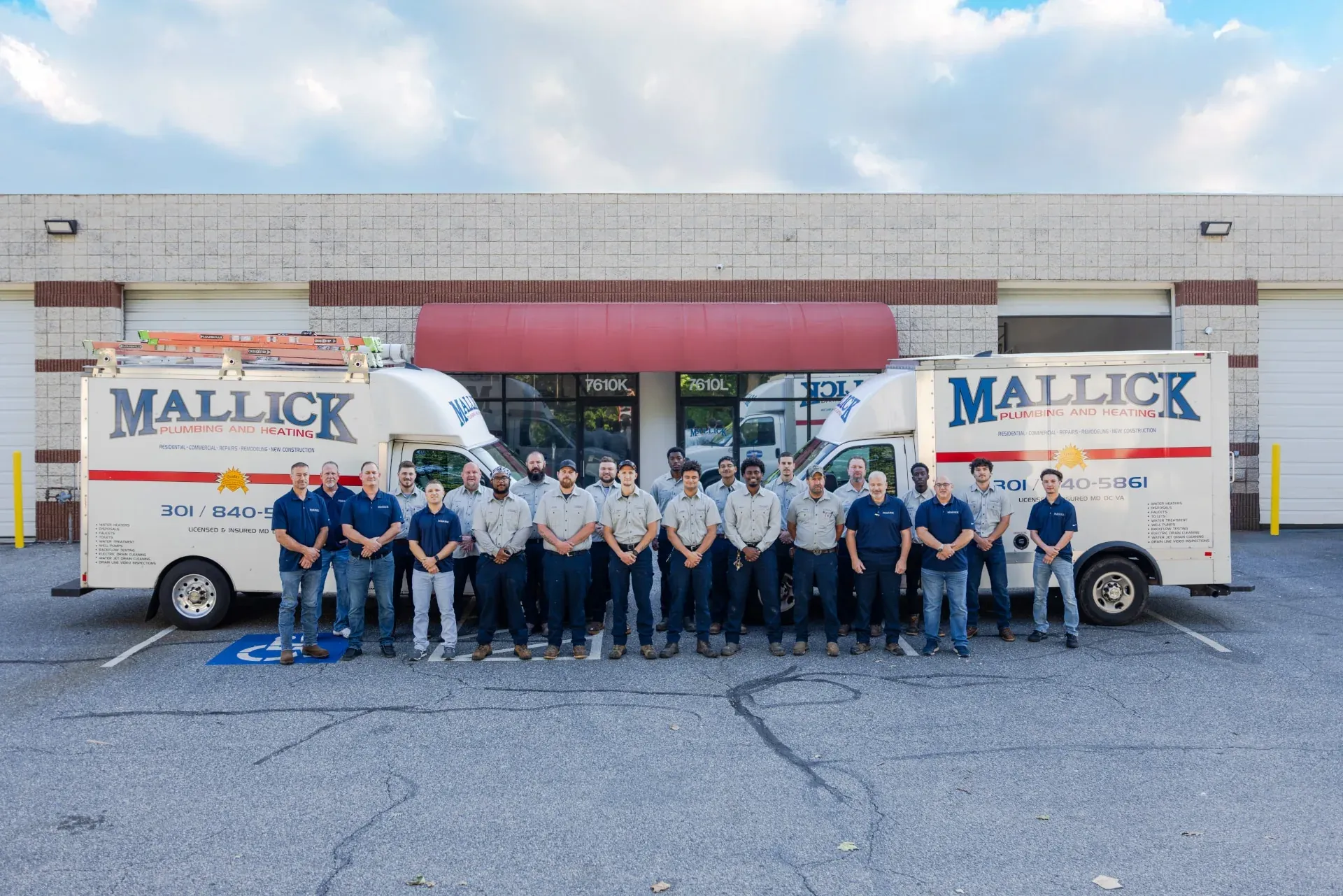 Mallick Plumbing & Heating service vans outside the Frederick shop